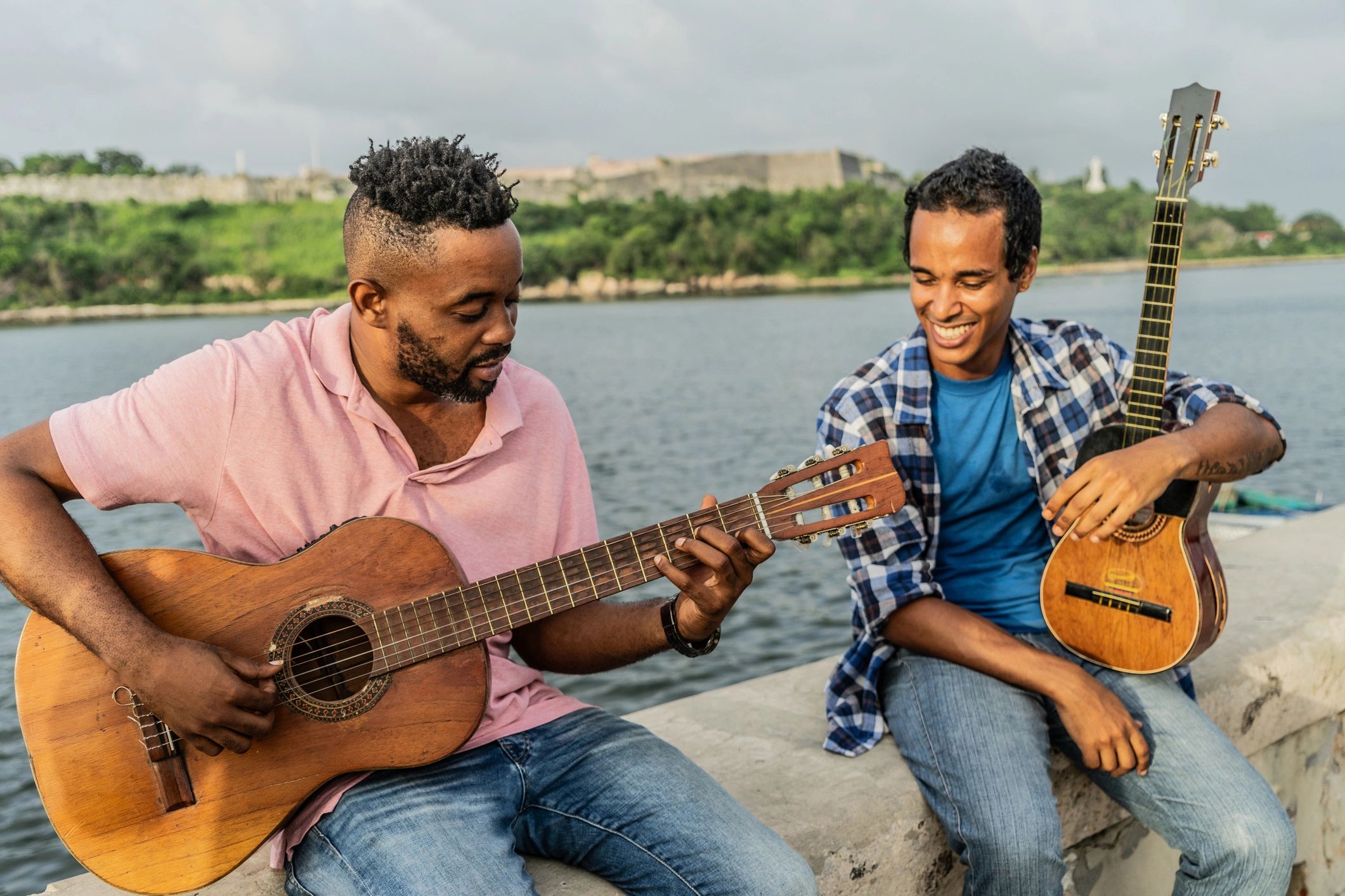 Musicians singing and playing instruments outdoors